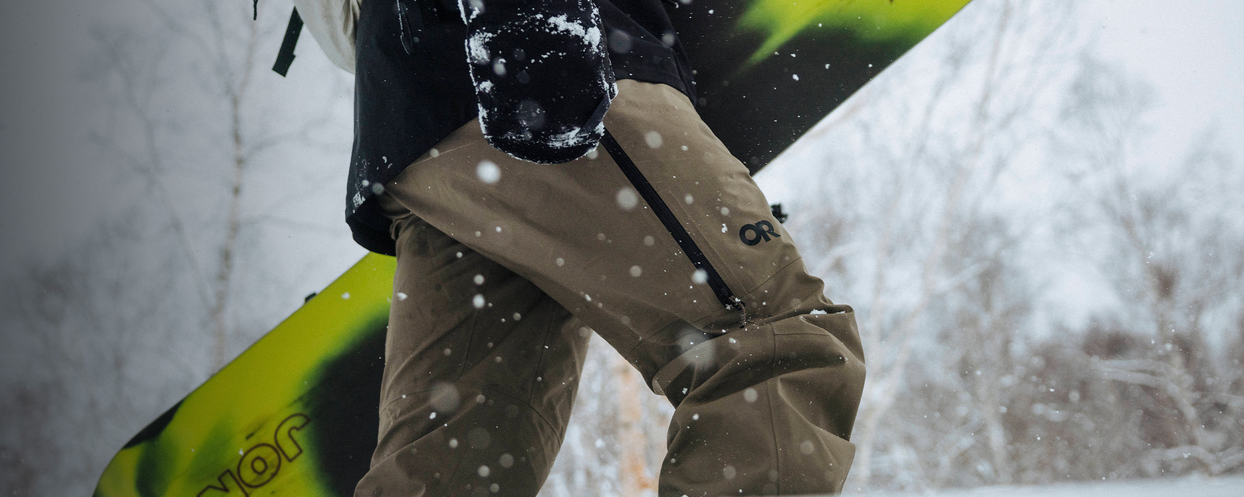 Male in the snow wearing Outdoor Research outerwear. 