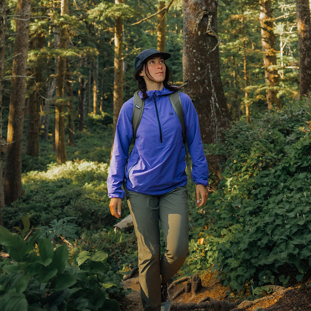 Women walking through the woods wearing Outdoor Research Women's Astroman Air Sun Hoodie