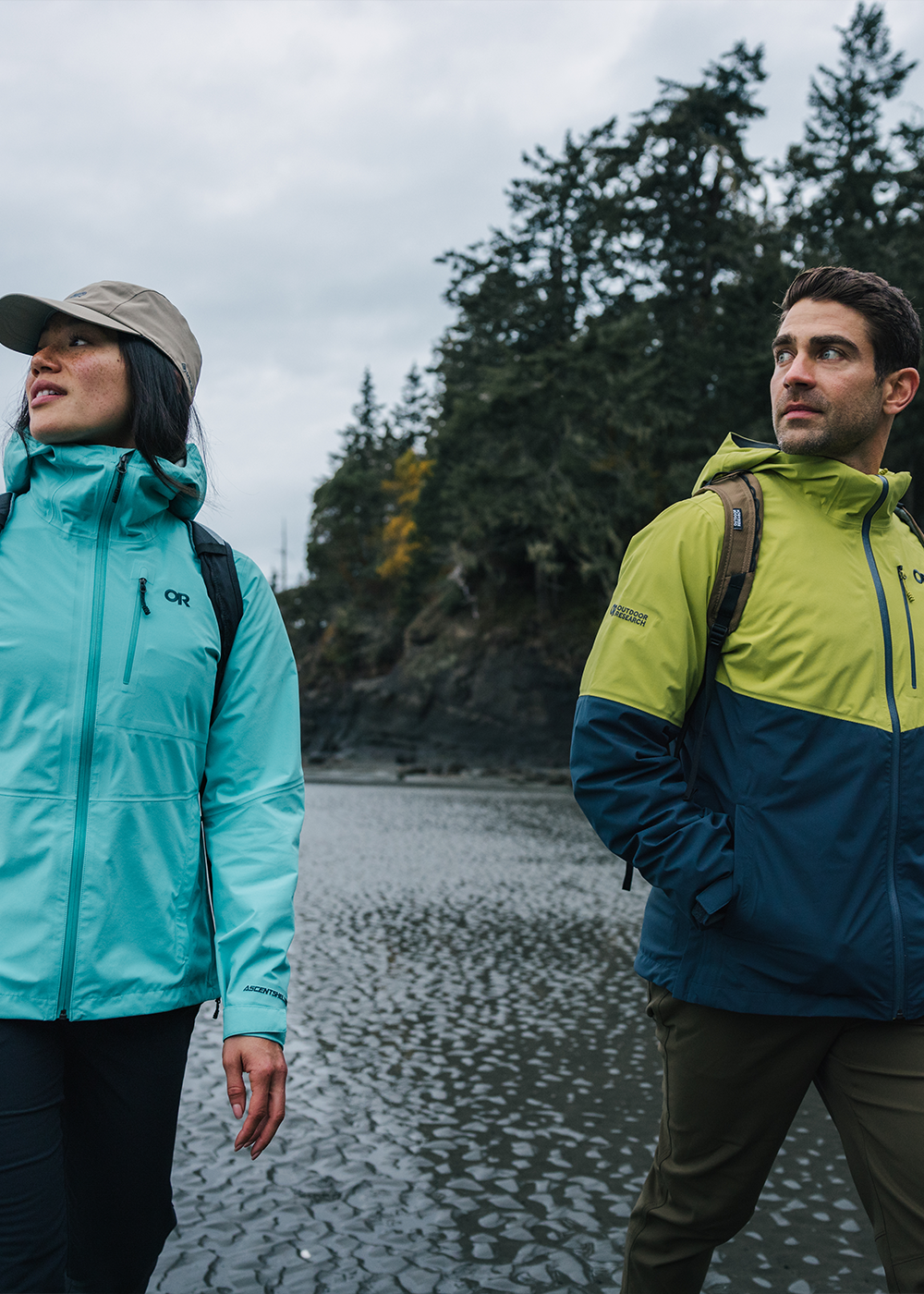 Outdoor Research Alpine Athlete Max Djenohan stands atop a summit while wearing the Foray 3L Jacket.