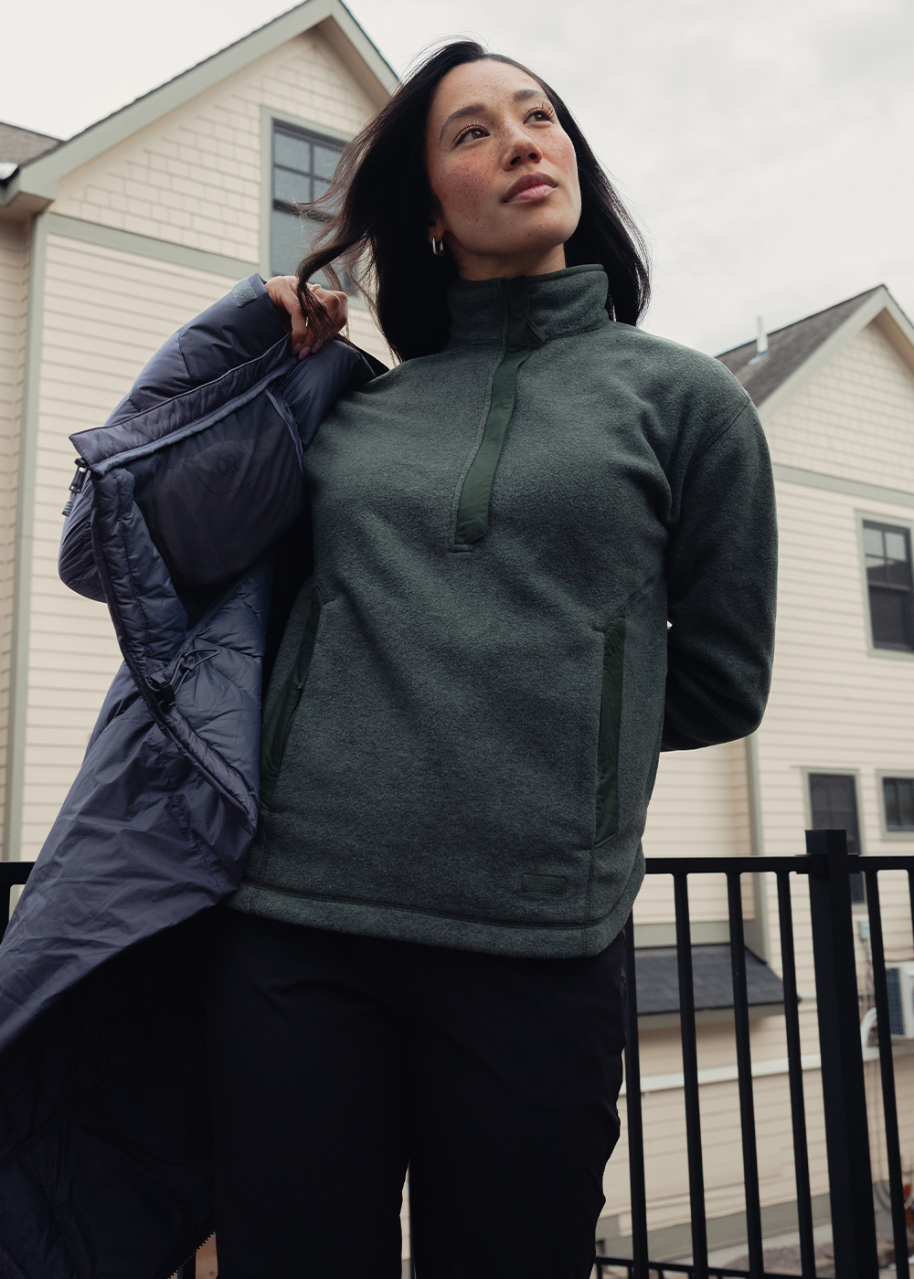 Woman outside wearing Outdoor Research Deming Fleece Pullover Dark Laurel. 