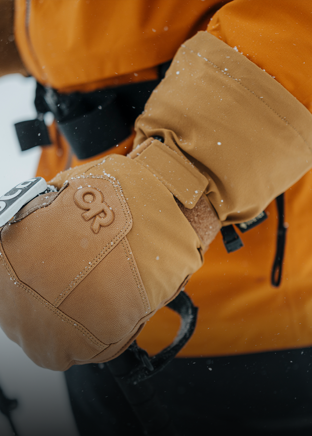 Male wearing Outdoor Research Team Gauntlet GORE-TEX Mitt Dark Natural. 