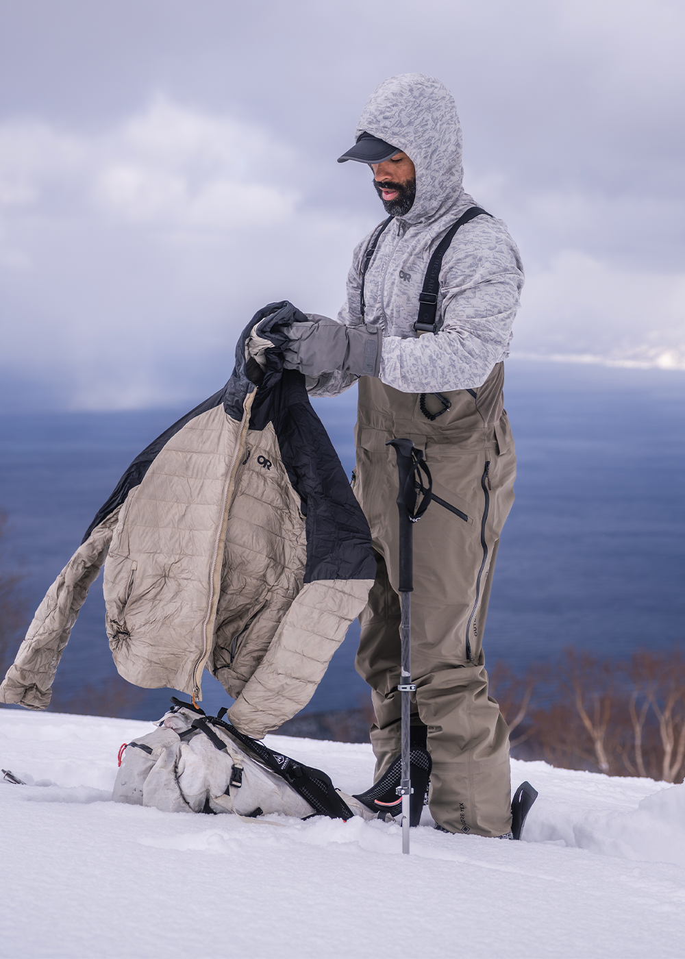 Skier in ski bibs in the deep powder snow